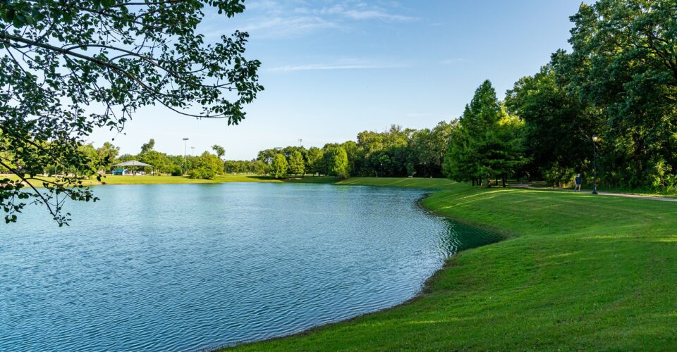 Bonnie Wenk outer loop trail with a view of the park pond and trail, with trees and forestry surrounding it
