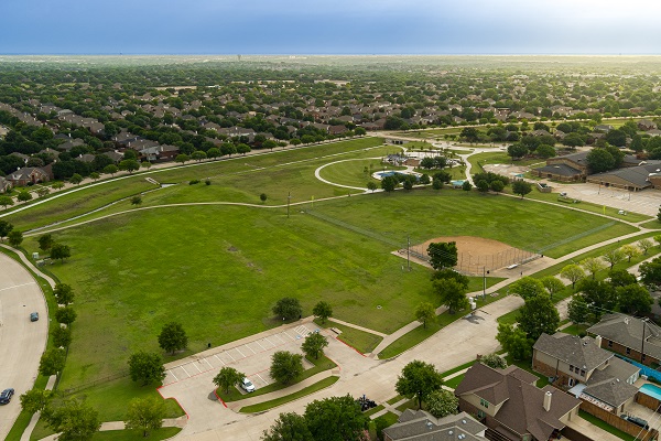 E.A. Randles aerial with parking, open space, ball fields, and playground in the background