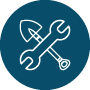White outline of a wrench and a shovel crossed over each other on a dark blue circular background.