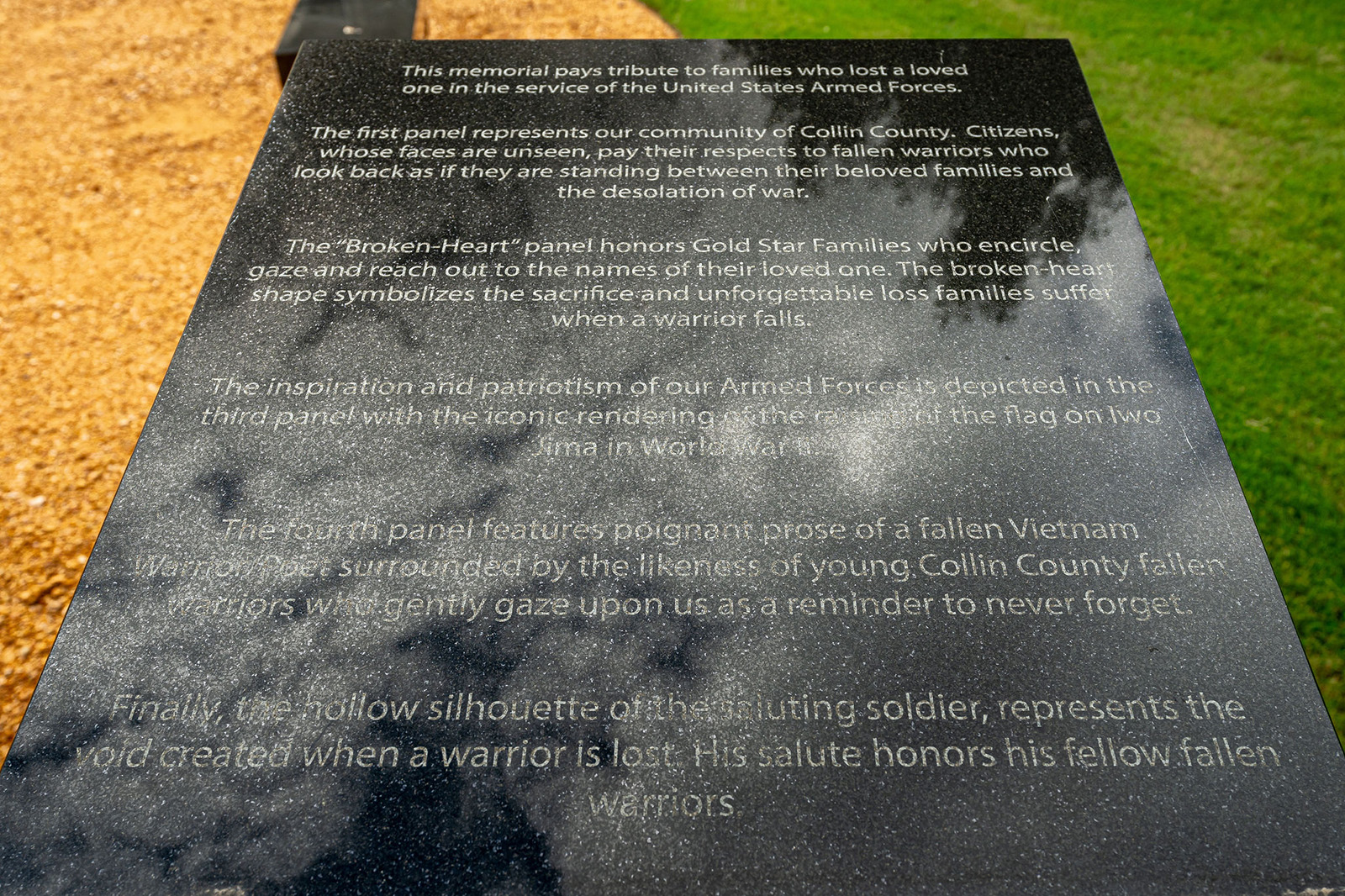 A memorial plaque with inscriptions honoring families of fallen US Armed Forces members, reflecting on loss, patriotism, and the sacrifice of soldiers from World War II to Vietnam.