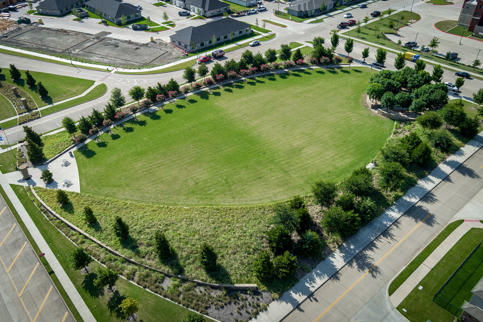 crescent park aerial photo of grassy area with trees surrounding it